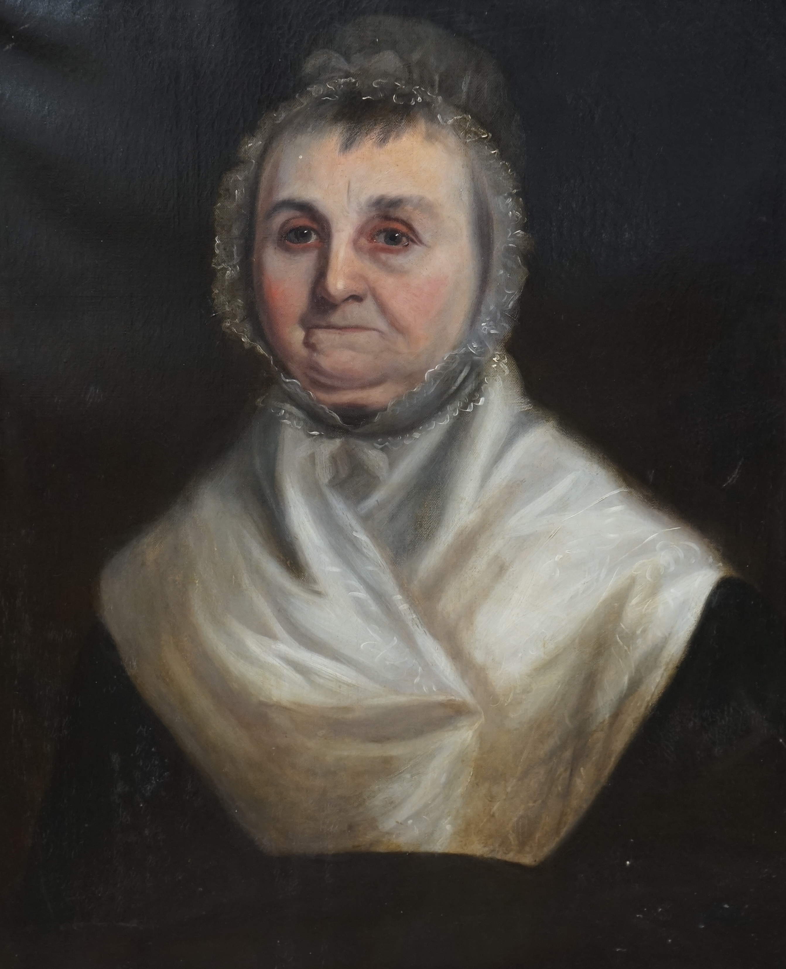 Late 18th / early 19th century English School, oil on canvas, Head and shoulders portrait of an elderly lady wearing a bonnet, unsigned, 74 x 62cm, label verso, ornately framed. Condition - fair, original canvas sagging